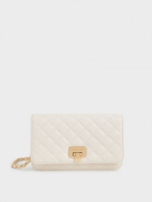 τσάντα clutch Charles And Keith Καπιτονέ Push-Lock κρέμα | 90128-HOKS