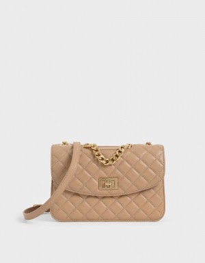τσάντα clutch Charles And Keith Καπιτονέ Turn-Lock Μπεζ | 01258-MFEZ