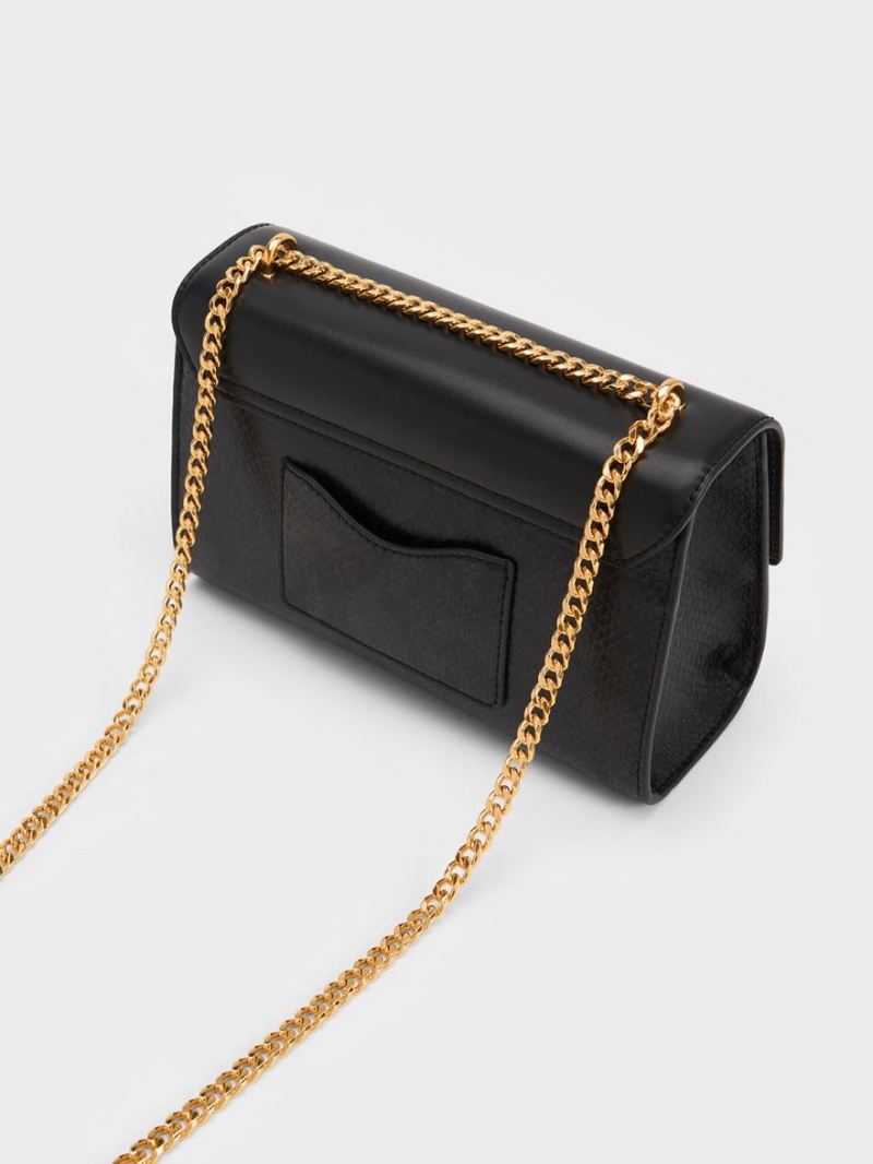 τσάντα clutch Charles And Keith Snake Print Metallic Accent μαυρα | 90763-AUMZ
