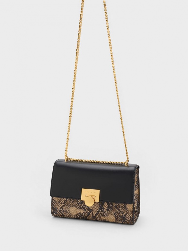 τσάντα clutch Charles And Keith Snake Print Metallic Accent μαυρα | 63102-UGNE
