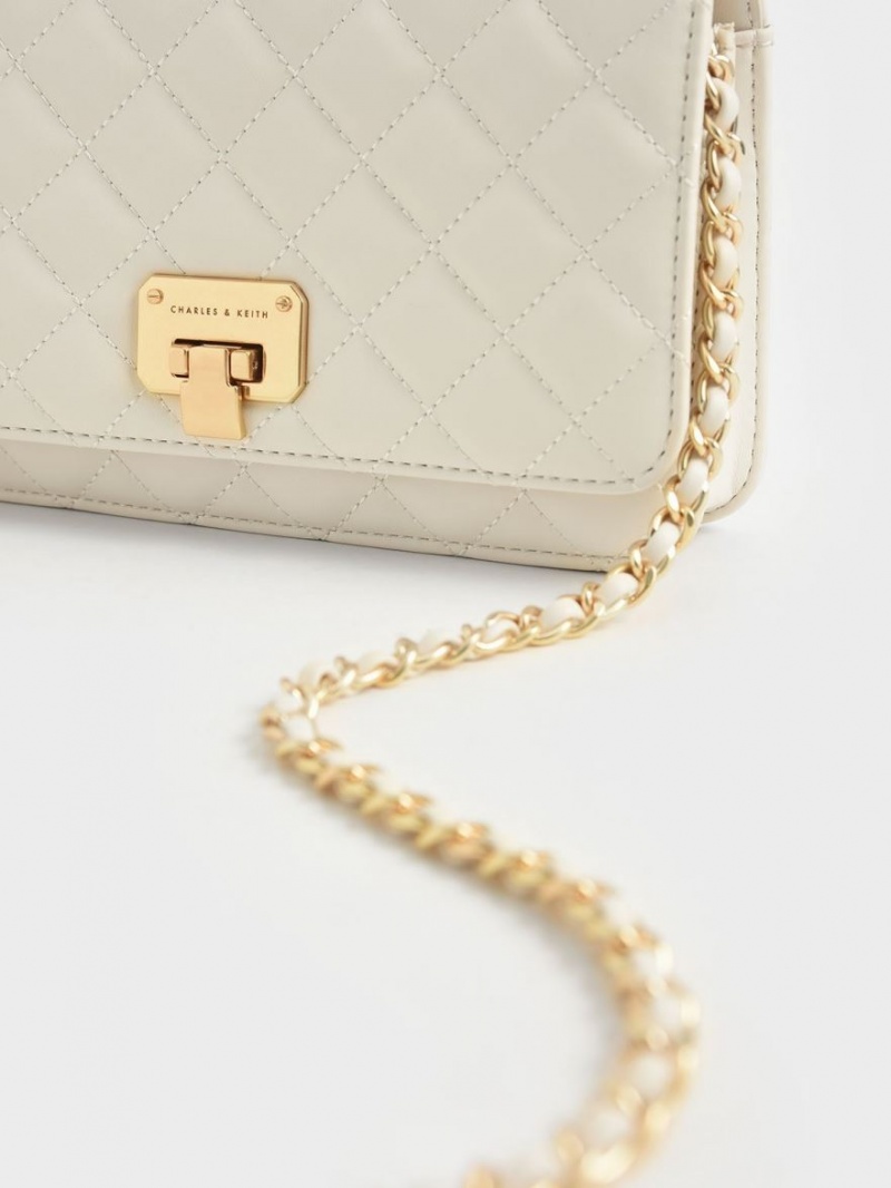 τσάντα clutch Charles And Keith Καπιτονέ Push-Lock κρέμα | 90128-HOKS