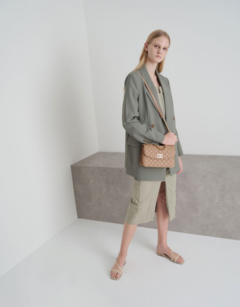 τσάντα clutch Charles And Keith Καπιτονέ Turn-Lock Μπεζ | 01258-MFEZ